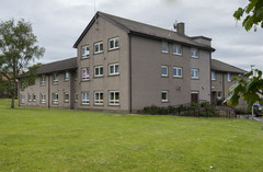 Mearns Court three storey building with large grass area