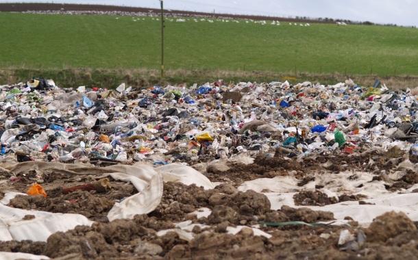 Landfill site with a lot of plastic close up 