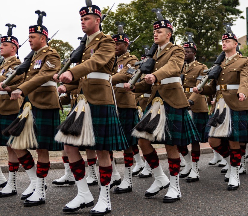 Men in kilts in a parade