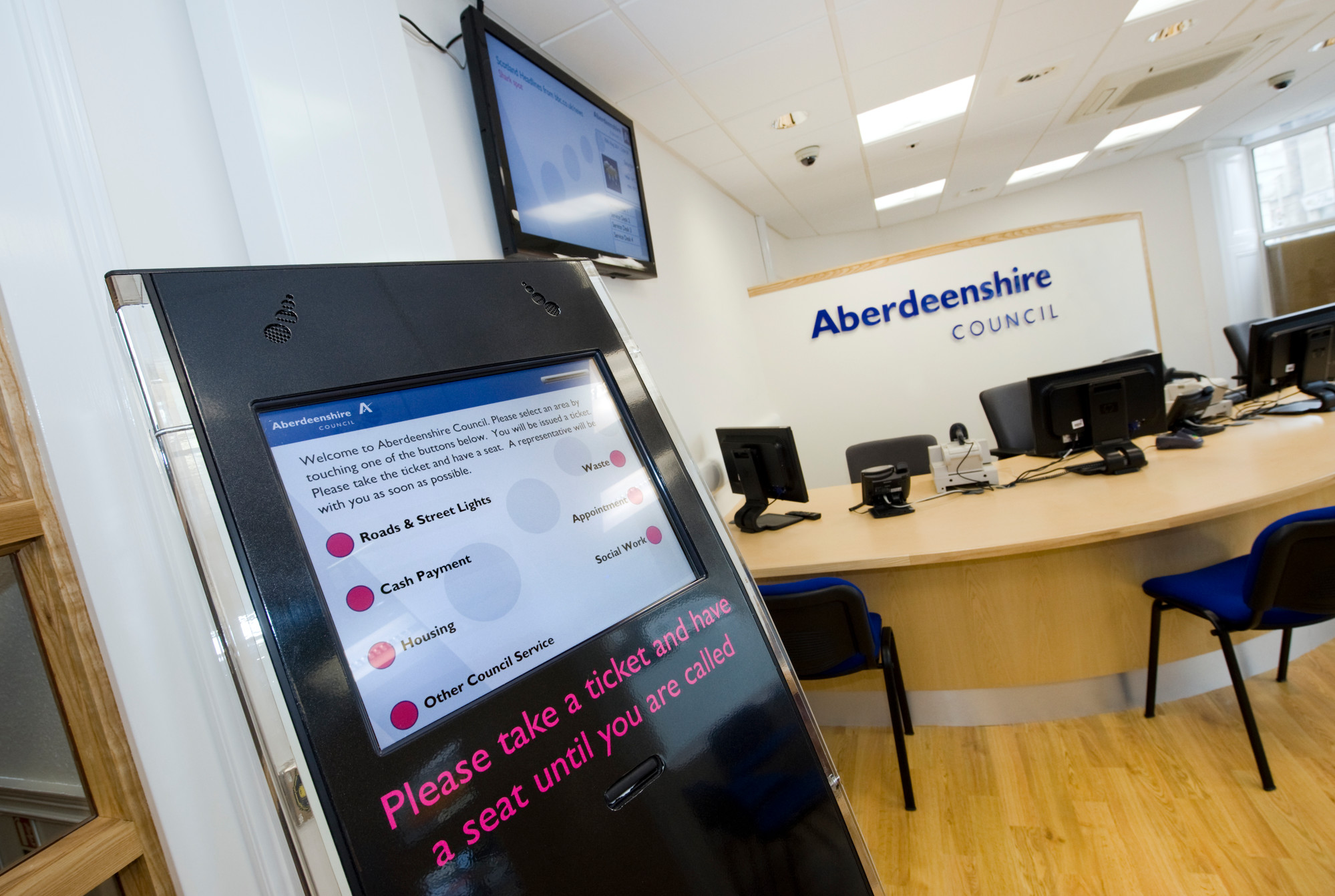 A picture of a service point self-serve display screen inside an Aberdeenshire Council building