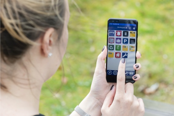 person using myAberdeenshire mobile app on the go