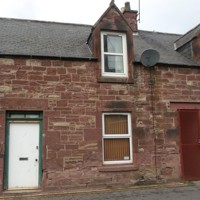 Front of 1 School Lane showing old front door and windows on top and bottom floor