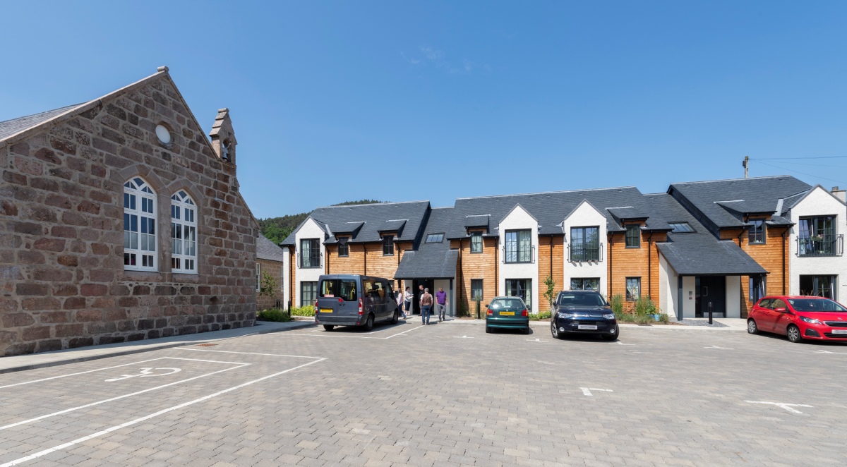 A building with cars parked in front of it