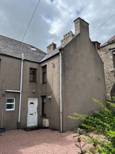 Tall building with front door to 16 Duke Street Huntly