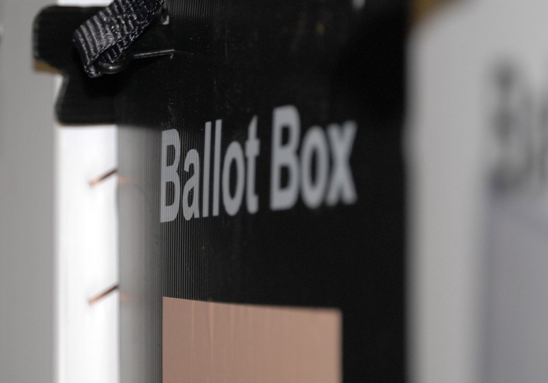A picture of a black ballot box with the words ballot box in white lettering