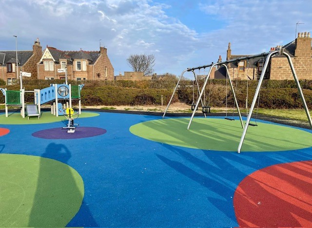 A colourful picture of the new play park facilities in Peterhead's Victoria Park including swings and climbing frame