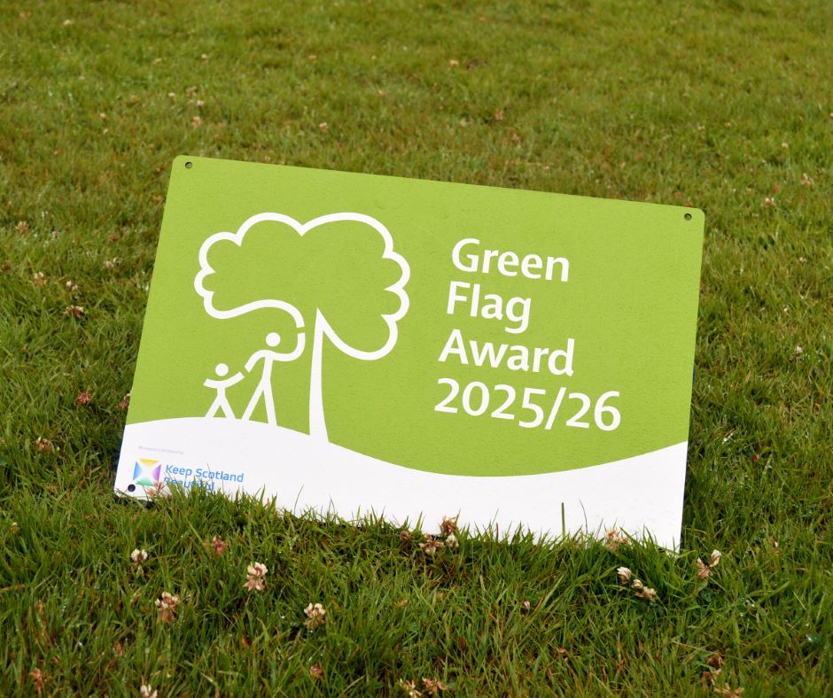 Green Flag Award sign on grass for 2025/26