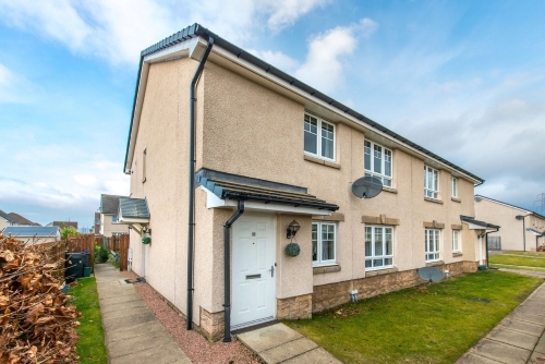 Front of property with a small front garden and a path to the door.