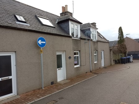 Front of the property on Martin Road with pavement along the front