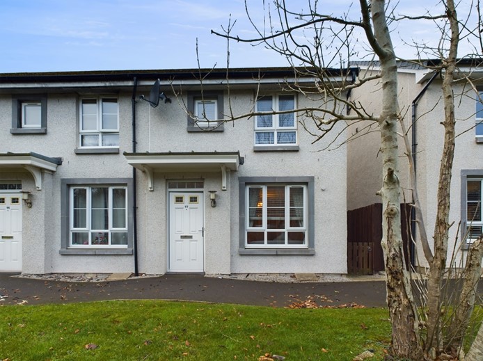 Front of the property at  57 Old Aberdeen Road, Balmedie with path running along the row of houses and side gate on the right