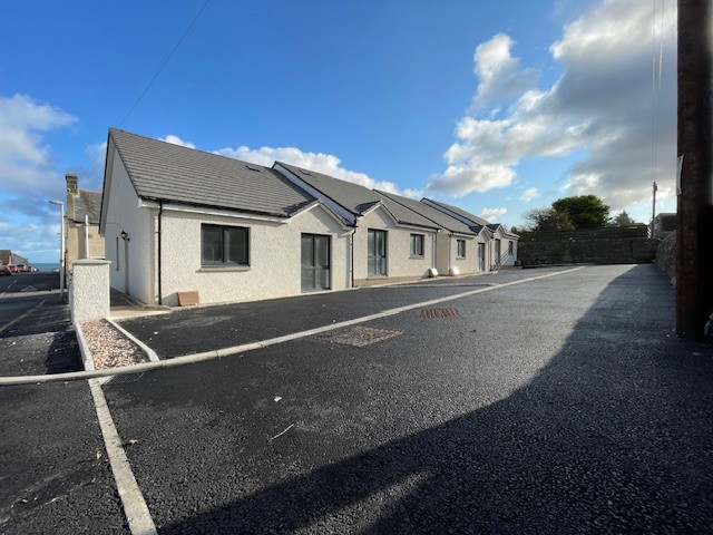 Front of the property at 4 Garden Street Court with glazed front door, side access and tarmac at the front