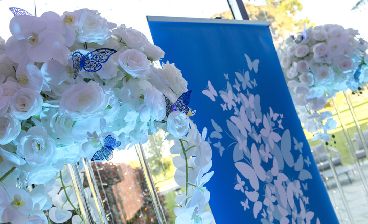 Close up of Inspiring Aberdeenshire decorations, showing flowers in a bunch and banner in background