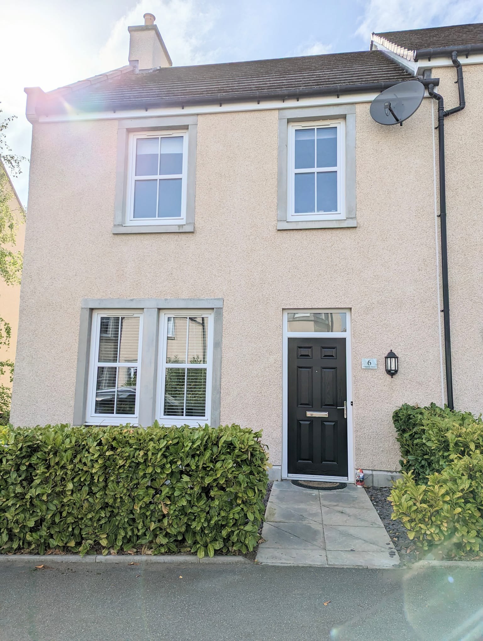 Front of 6 Simpson Street in Insch, stone path to front door with hedge either side