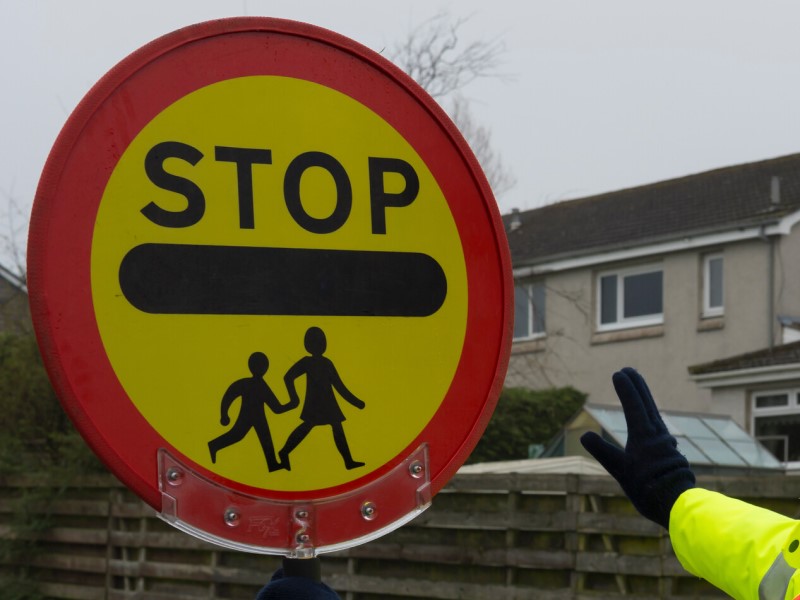 A school crossing lollipop sign